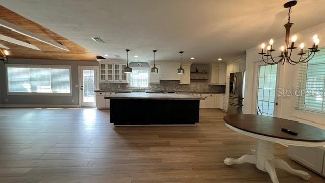 Stunning 5 bedroom 3 bath pool home with fenced yard and inground pool on oversized lot property image