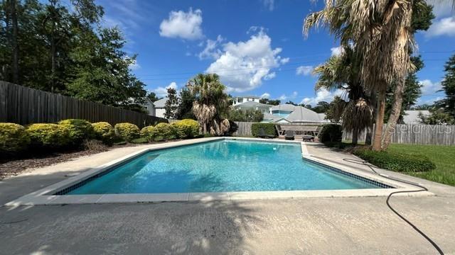 Stunning 5 bedroom 3 bath pool home with fenced yard and inground pool on oversized lot property image