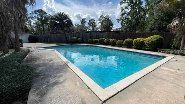 Stunning 5 bedroom 3 bath pool home with fenced yard and inground pool on oversized lot property image